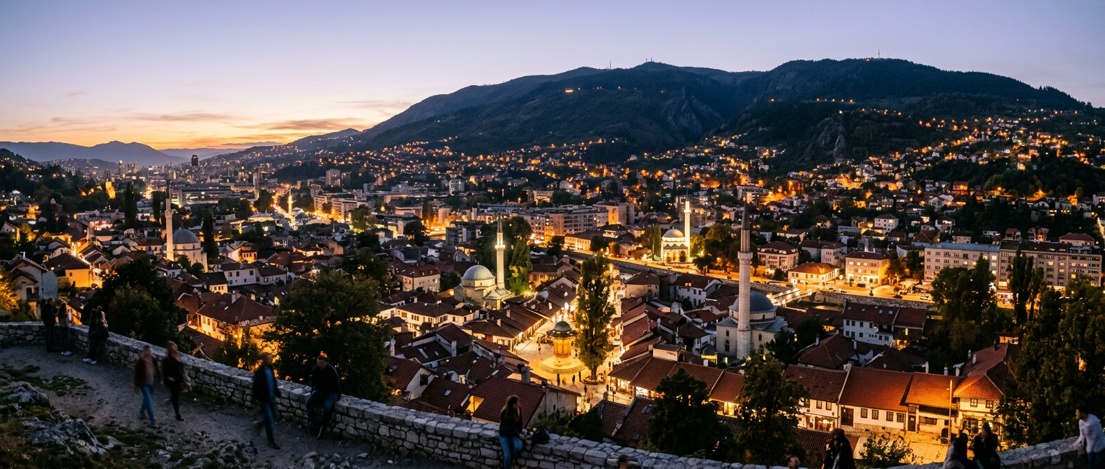 Sarajevo valley at dusk seen from the Yellow Fortress, with minarets and red roofs